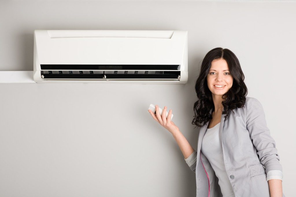 woman with an air conditioner