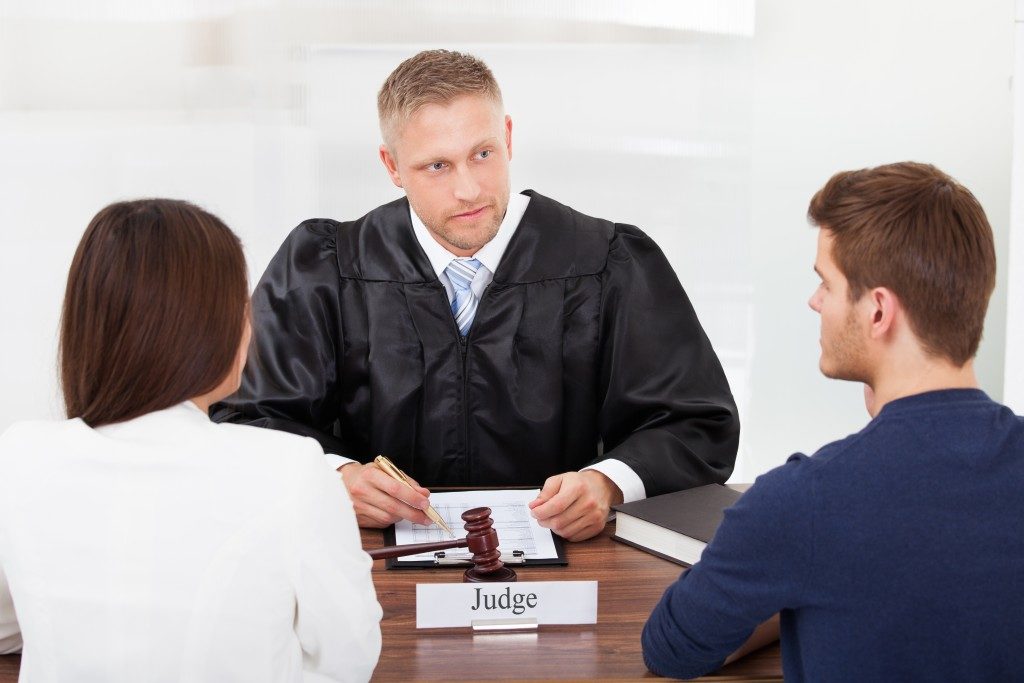 judge talking to a couple